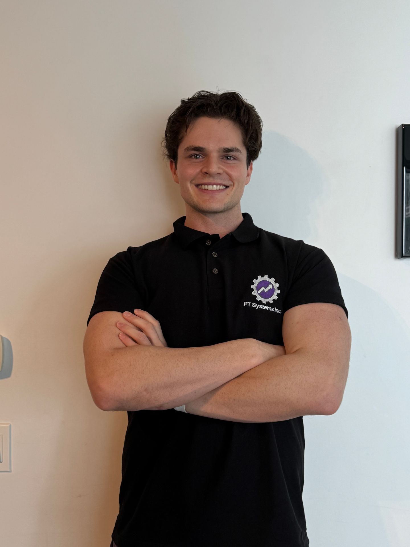 Justin, CEO and Co-Founder of PTSI, wearing business-casual attire, specializing in gym growth strategy, backend operations, and sales systems for independent gyms.